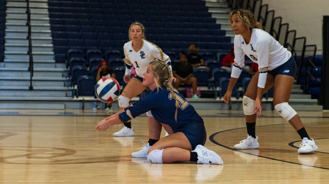 Anniston Jones digs a ball against Blue Mountain College. (Photo by David Miller)