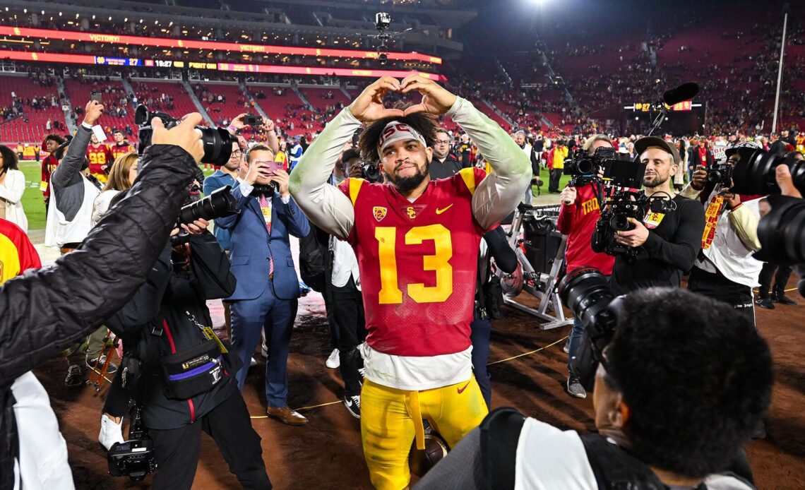 USC Trojans Football quarterback Caleb Williams celebrates with heart gesture