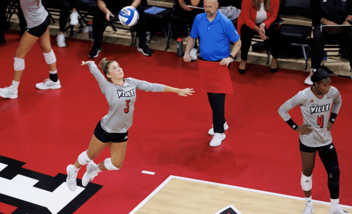 Louisville's Kamden Schrand serves an ace against South Dakota.