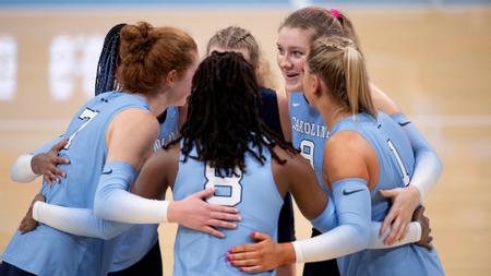 The Tar Heels huddle on the court.