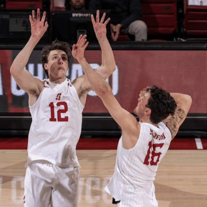 Nathan Lietzke sets Stanford teammate Nathaniel Gates in an NCAA men's volleyball match in Palo Alto, California, January 10 2024