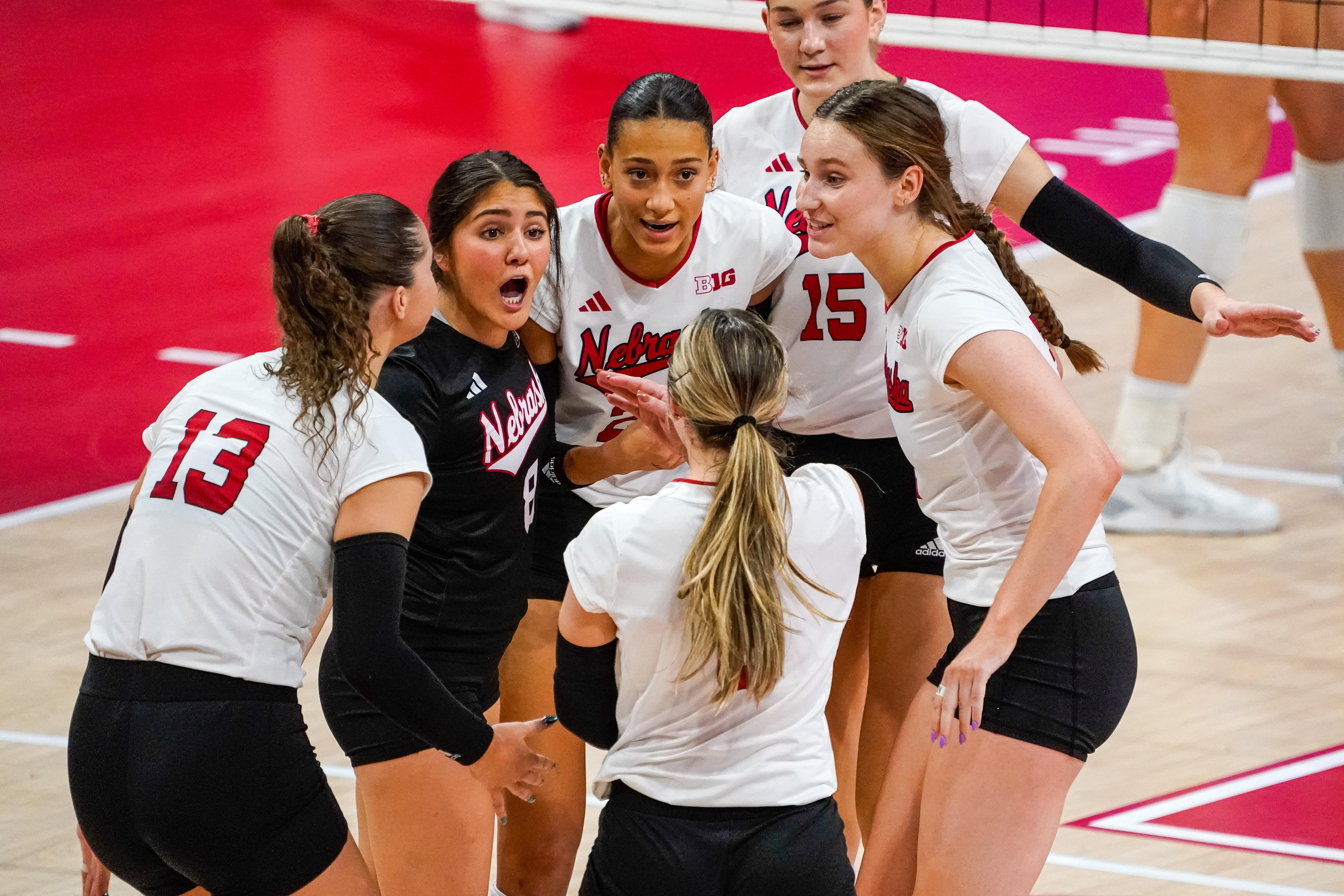 Nebraska players celebrate after a point against Wisconsin